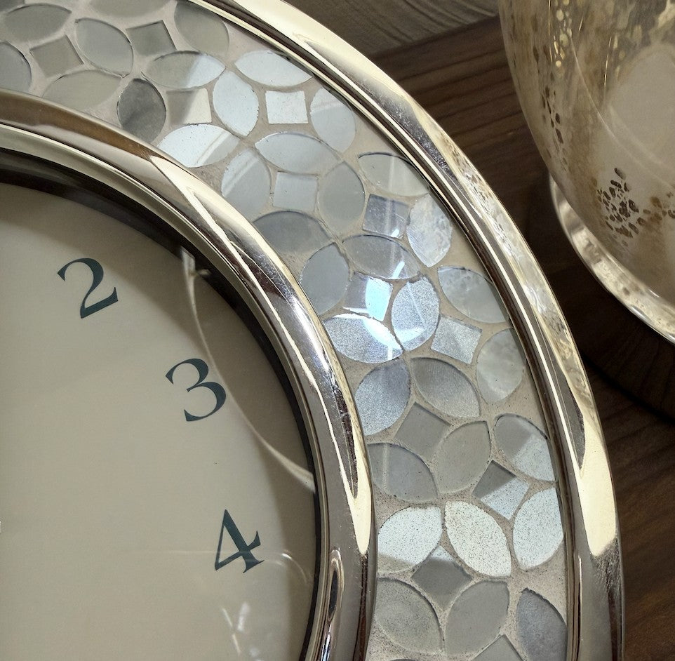 Flowers on the Beach elegant silver and white pearlescent wall clock with mosaic detail and clean numerals.
