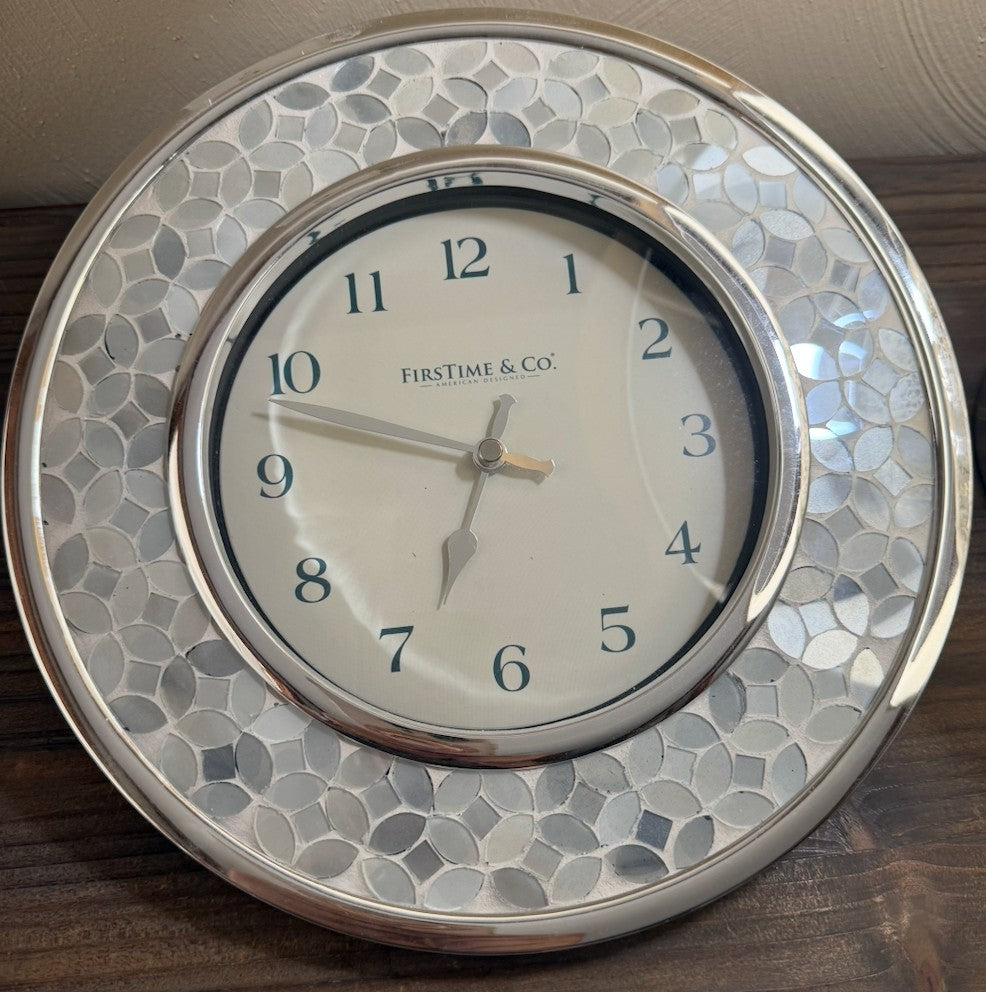 Flowers on the Beach elegant silver and white pearlescent wall clock with a mosaic border and cream face.